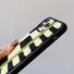 Side view showing the thickness and fuzzy edges of the Sherpa Green Stripe case.