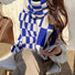 Model wearing a plaid wool scarf , easy for weekend styling and gifting.