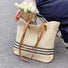Flat lay of Woven Straw Tote Bag in Beige, great for everyday carry and travel.